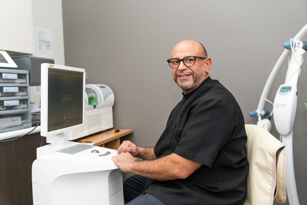 reservoir vic dentist at computer