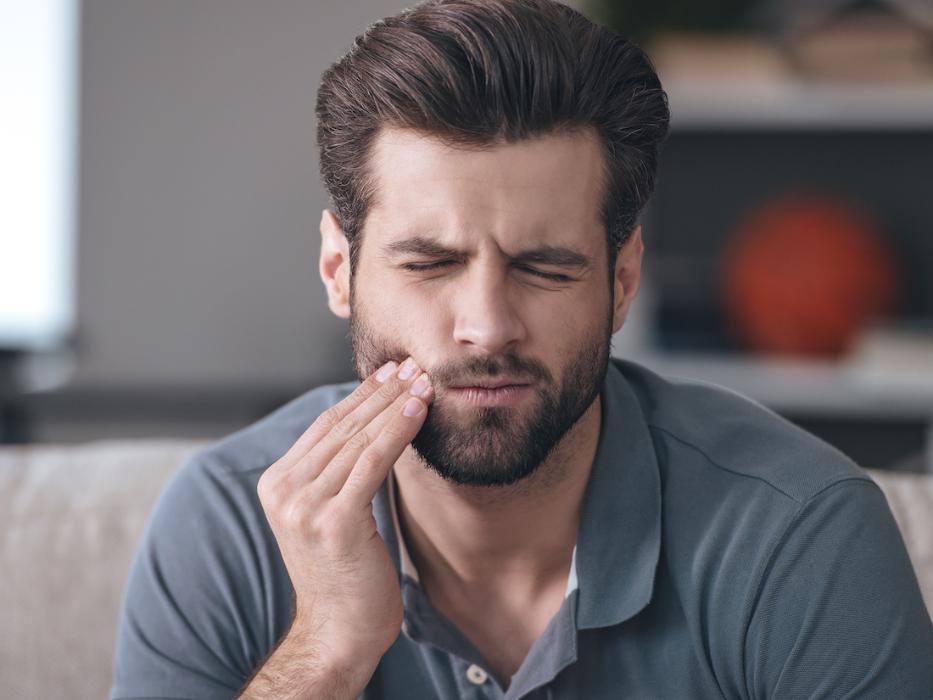 man with tooth pain in reservoir | emergency dentist reservoir